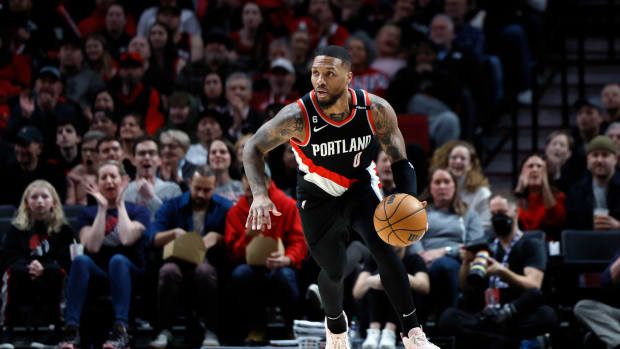 Portland Trail Blazers guard Damian Lillard dribbles the ball.